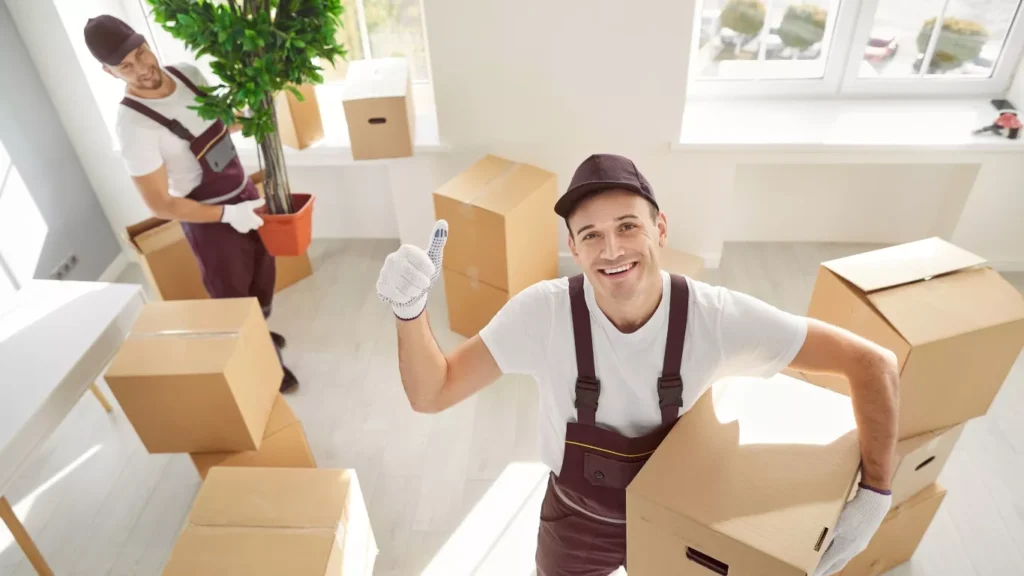 professional movers and packers loading furniture safely